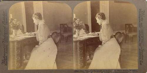 First Lady Edith Roosevelt at a writing desk.