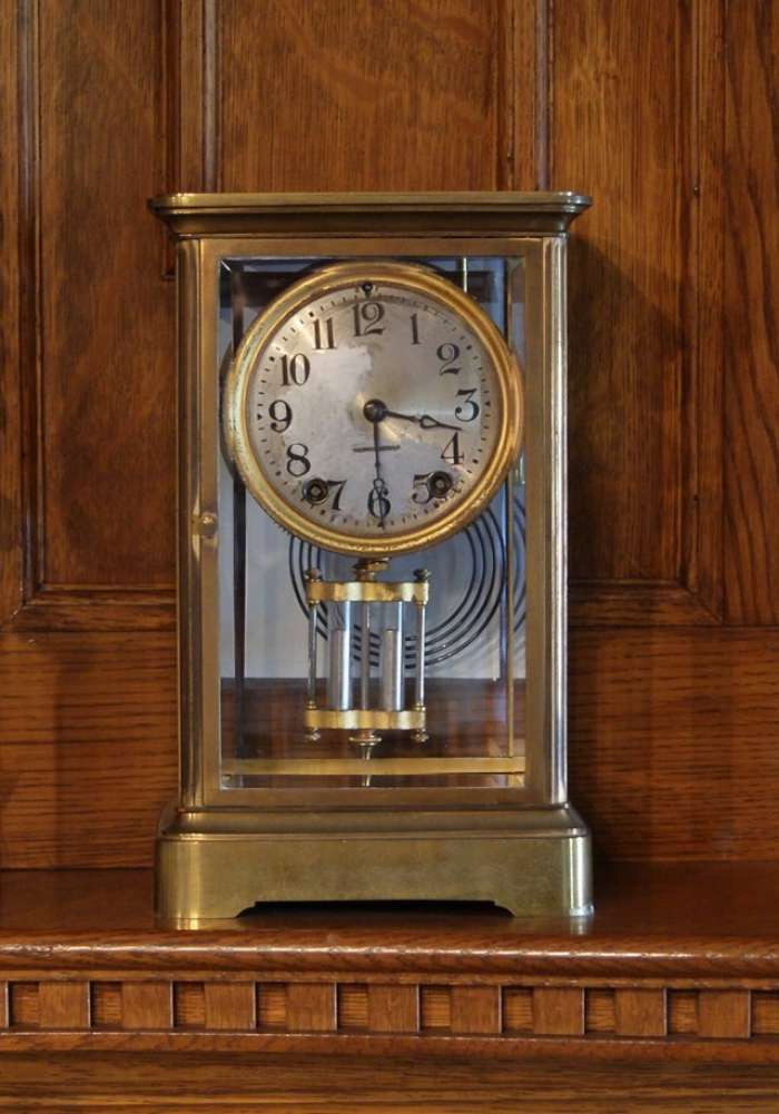 Mantle clock with brass frame